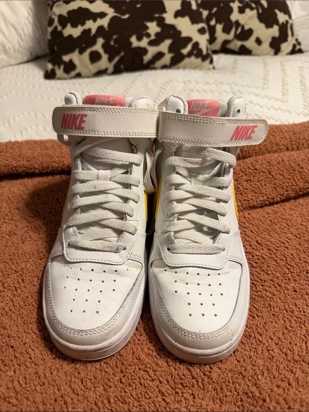 Nike White Mid-Top Sneakers with Yellow Swoosh